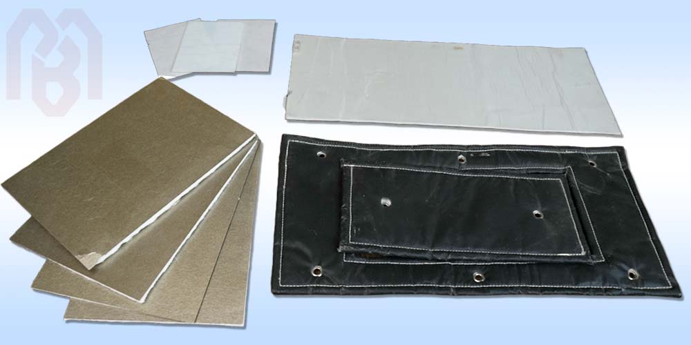 Various composite insulation components including foil-faced panels and stitched covers, manufactured by PBM for multi-layer thermal protection.