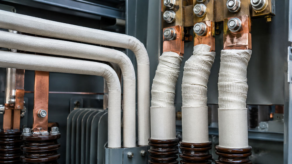 Fiberglass sleeves and tapes protecting electrical conductors and termination zones